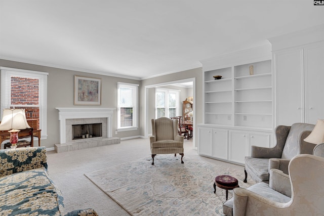 living area with light carpet, baseboards, crown molding, and a tile fireplace