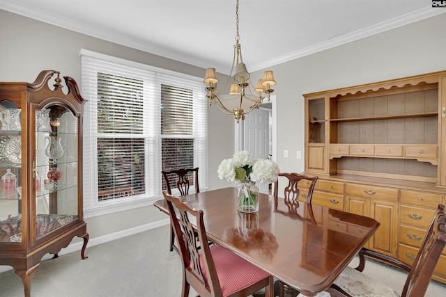 dining room featuring ornamental molding, light carpet, baseboards, and an inviting chandelier