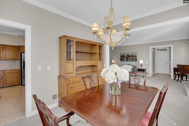 dining area featuring a notable chandelier, ornamental molding, baseboards, and light colored carpet