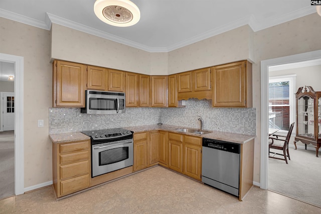 kitchen featuring light stone counters, a sink, ornamental molding, appliances with stainless steel finishes, and backsplash