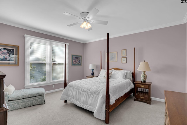 bedroom featuring light colored carpet, crown molding, and baseboards