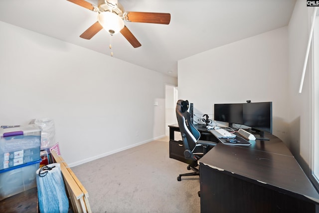 home office featuring ceiling fan, baseboards, and carpet flooring