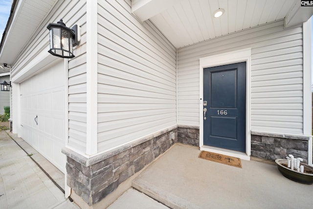 property entrance featuring a garage