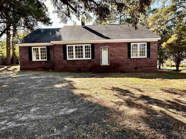 ranch-style home featuring roof with shingles, brick siding, and crawl space