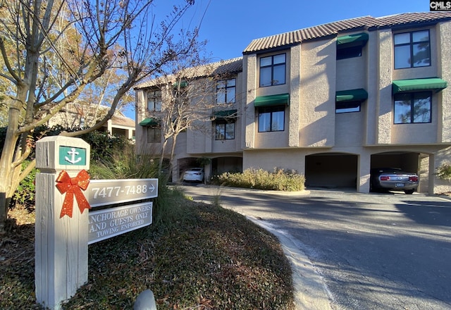 view of building exterior with driveway