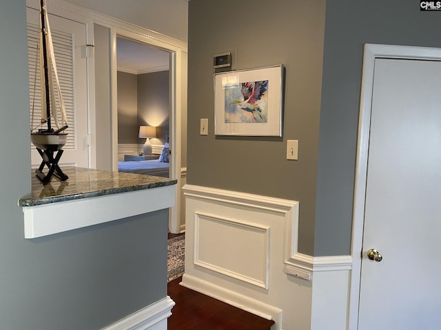 interior details with crown molding and wood finished floors