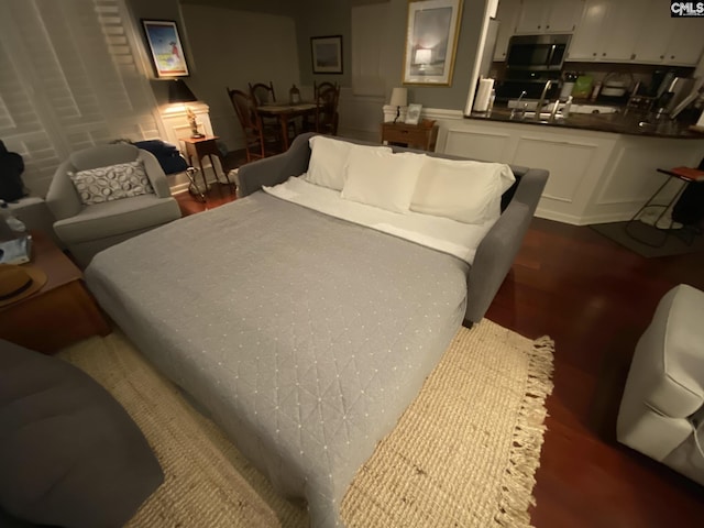 bedroom featuring dark wood finished floors