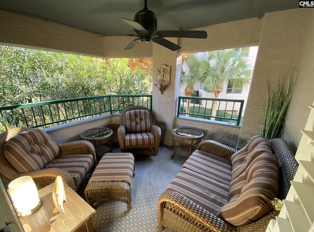 balcony with an outdoor hangout area and a ceiling fan