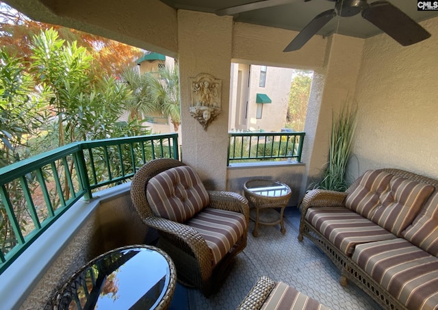 balcony featuring ceiling fan and a sunroom