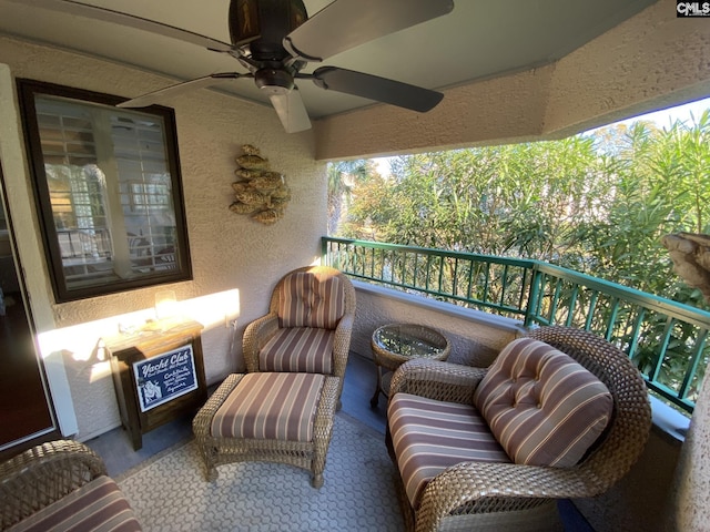 balcony featuring a ceiling fan