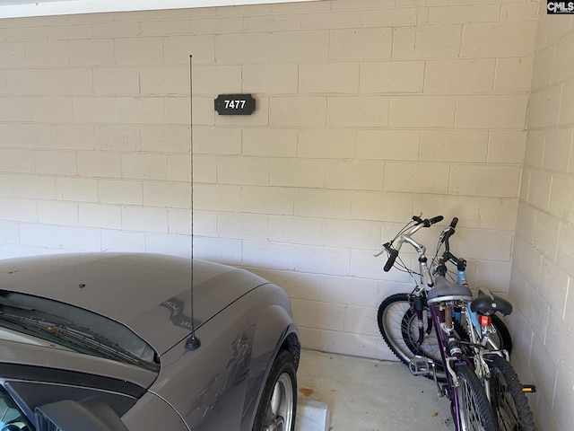 garage with concrete block wall