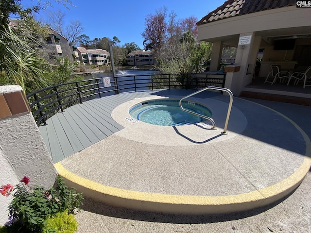 view of swimming pool with a residential view and a community hot tub