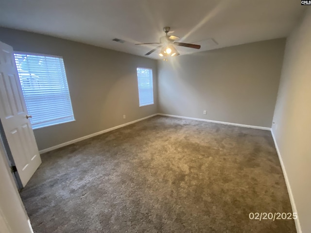 unfurnished room with ceiling fan, carpet floors, visible vents, and baseboards