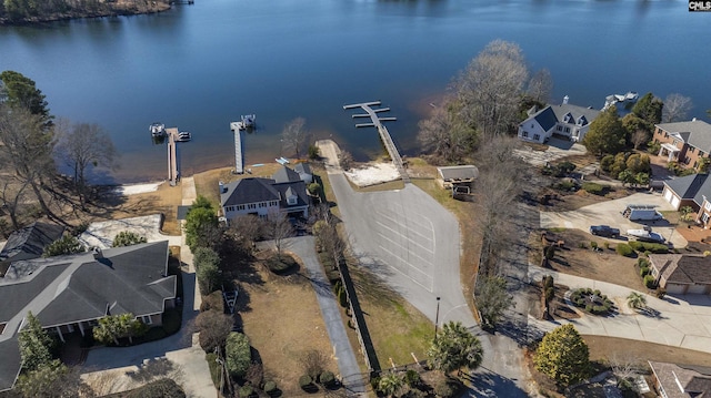 bird's eye view with a water view and a residential view