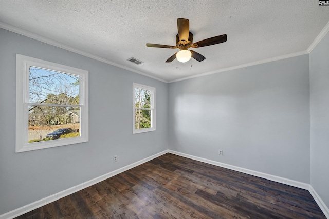 unfurnished room with a textured ceiling, visible vents, baseboards, ornamental molding, and dark wood finished floors