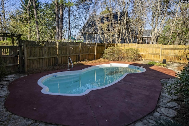 view of swimming pool featuring a fenced in pool and a fenced backyard