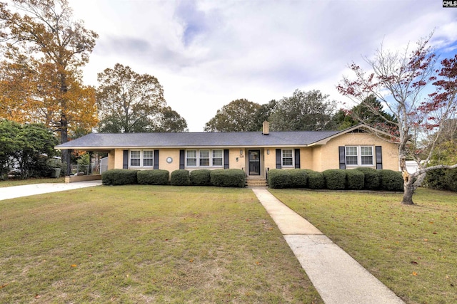 ranch-style house featuring concrete driveway, a chimney, and a front lawn