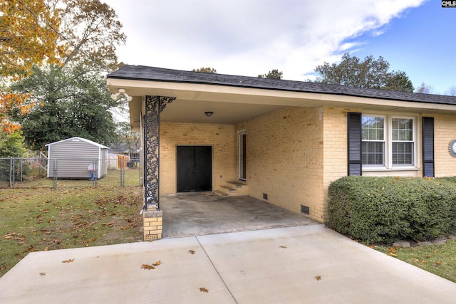 exterior space featuring crawl space, fence, and brick siding