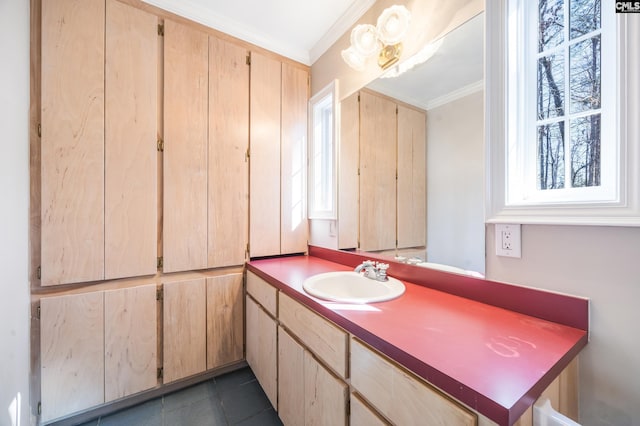 bathroom featuring ornamental molding, tile patterned flooring, and vanity