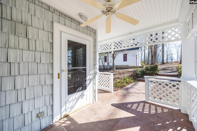 exterior space with a ceiling fan