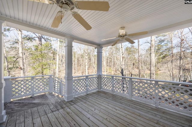 wooden terrace featuring ceiling fan