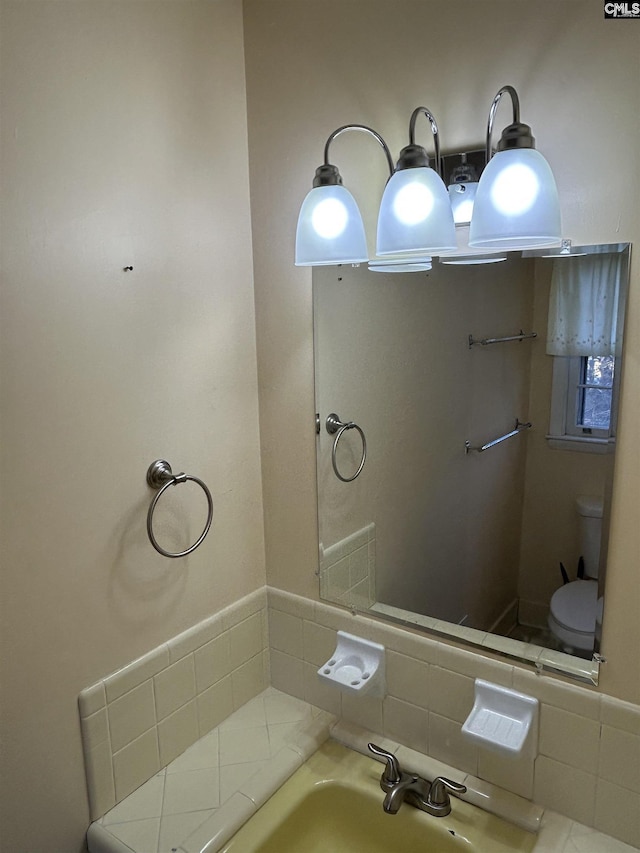 bathroom featuring a sink and toilet