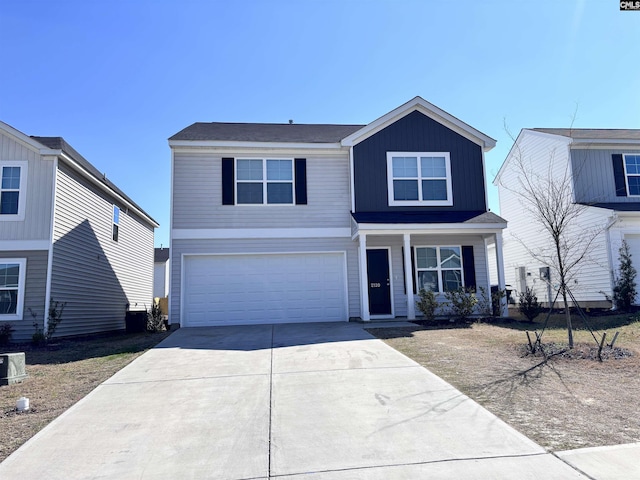 view of front of house with central AC unit, concrete driveway, an attached garage, a porch, and board and batten siding