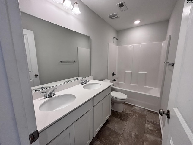 full bathroom with double vanity, visible vents, toilet, shower / tub combination, and a sink