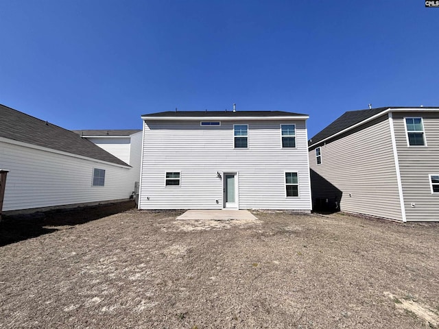 back of property featuring a patio