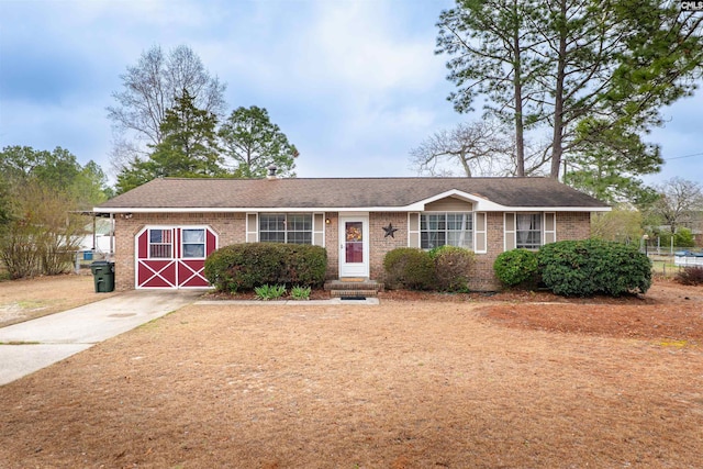 ranch-style home with brick siding and driveway