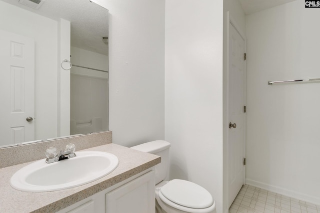 full bath with visible vents, toilet, vanity, baseboards, and tile patterned floors