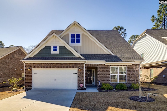 craftsman-style house featuring brick siding, roof with shingles, concrete driveway, board and batten siding, and a garage