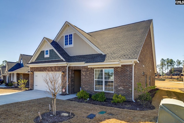 view of front of property featuring a shingled roof, concrete driveway, and brick siding