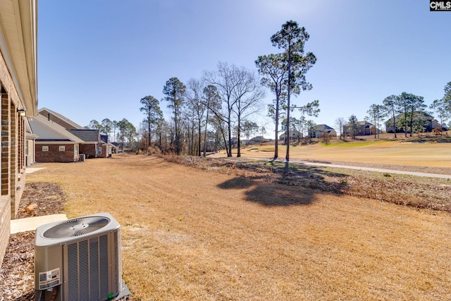 view of yard featuring central AC unit