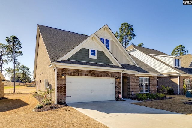 view of front of property featuring a shingled roof, concrete driveway, and brick siding