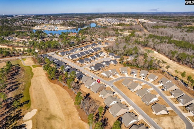 birds eye view of property with a water view and a residential view