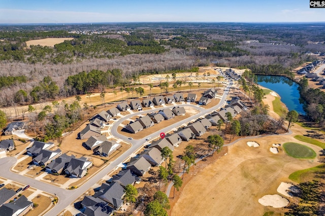 bird's eye view with a water view, a residential view, and a view of trees