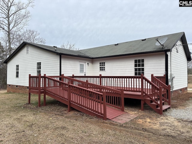 back of property featuring crawl space, roof with shingles, and a wooden deck