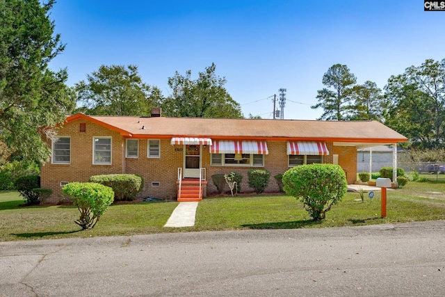 ranch-style home featuring a front yard, crawl space, and brick siding