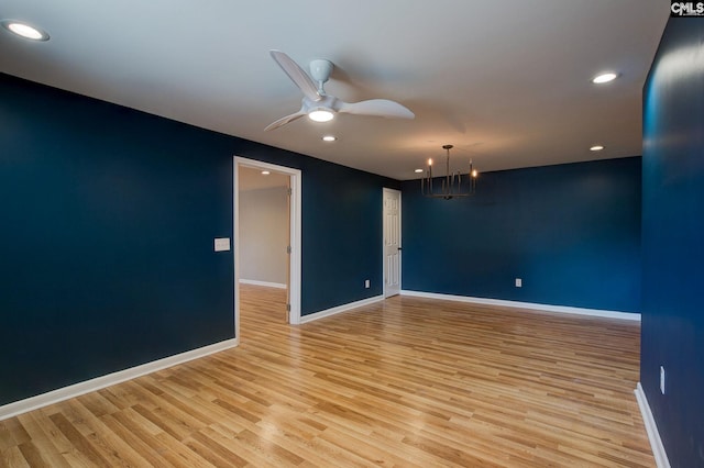 empty room featuring recessed lighting, baseboards, ceiling fan, and light wood finished floors