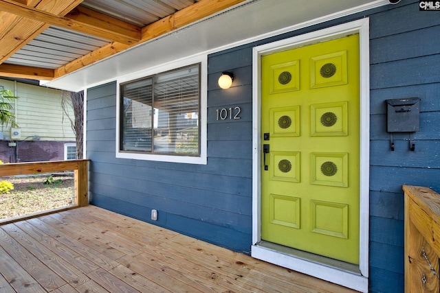 doorway to property featuring covered porch