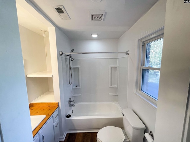 full bath with bathtub / shower combination, visible vents, vanity, and toilet