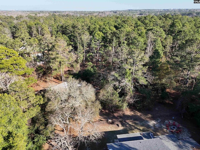 aerial view featuring a forest view