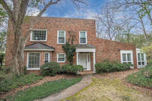 view of front of house featuring brick siding