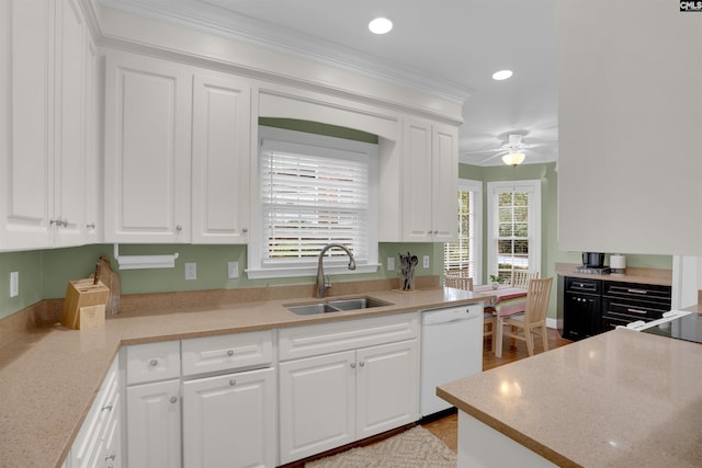 kitchen featuring ornamental molding, a sink, recessed lighting, white cabinets, and dishwasher