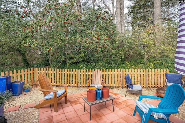 view of patio / terrace featuring fence