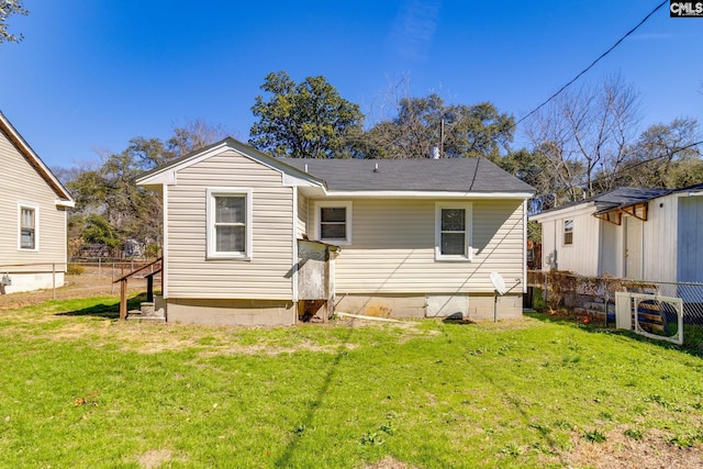 back of property featuring ac unit, a yard, and fence