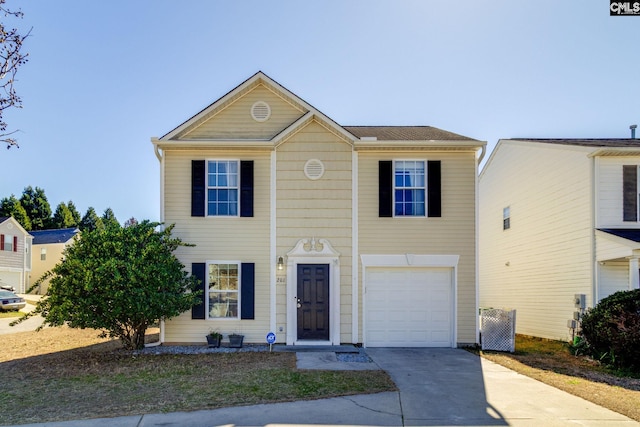 view of front of house featuring concrete driveway and an attached garage