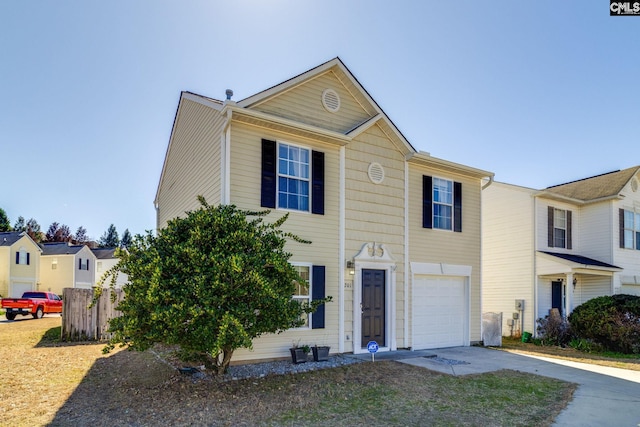 view of front of home featuring driveway and an attached garage