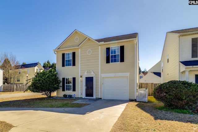 view of front facade with a garage, concrete driveway, and fence